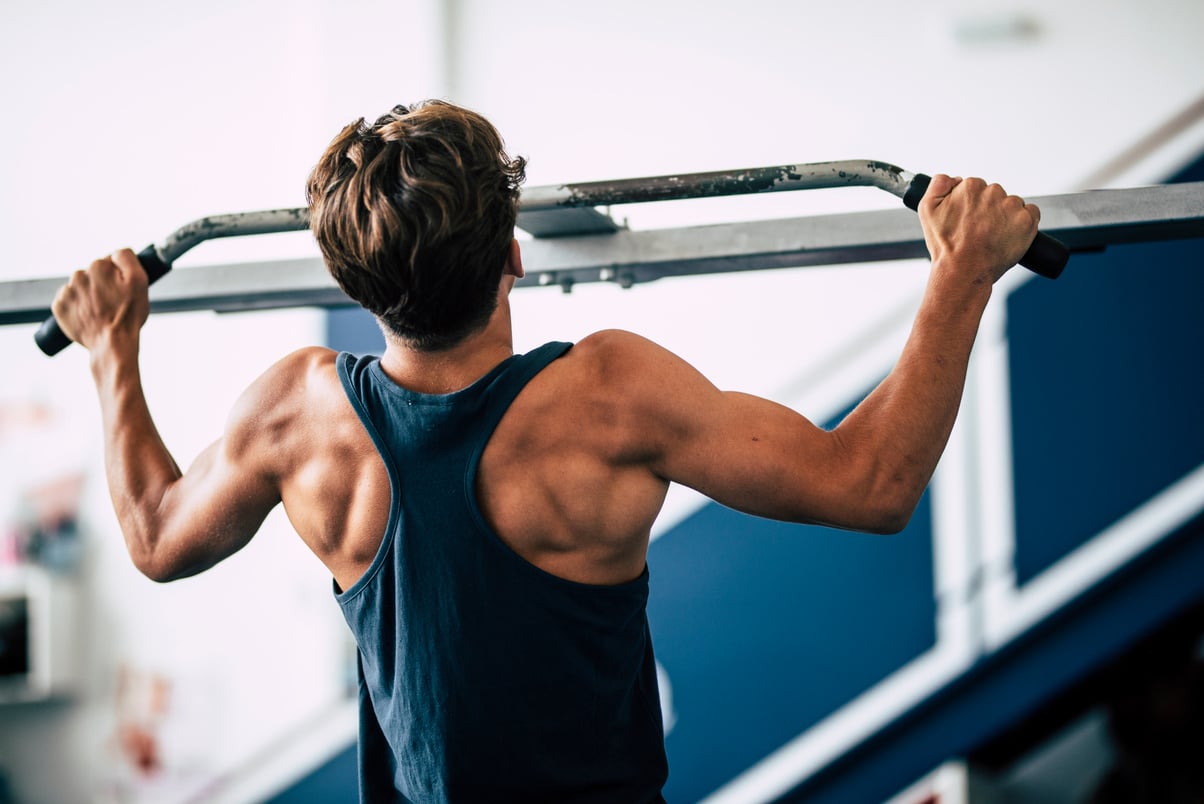 Teenager at the Gym Alone Working Is Body and Training